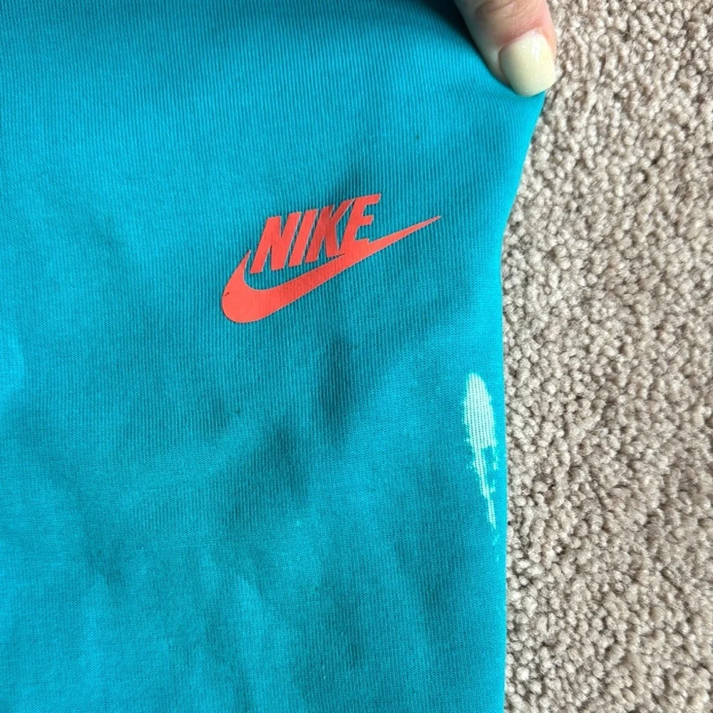 Nike Men's Teal Shorts with Red Logo